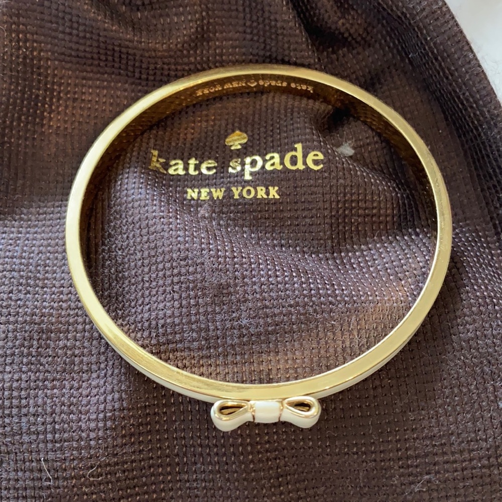 KateSpade cream and gold bangle with bow